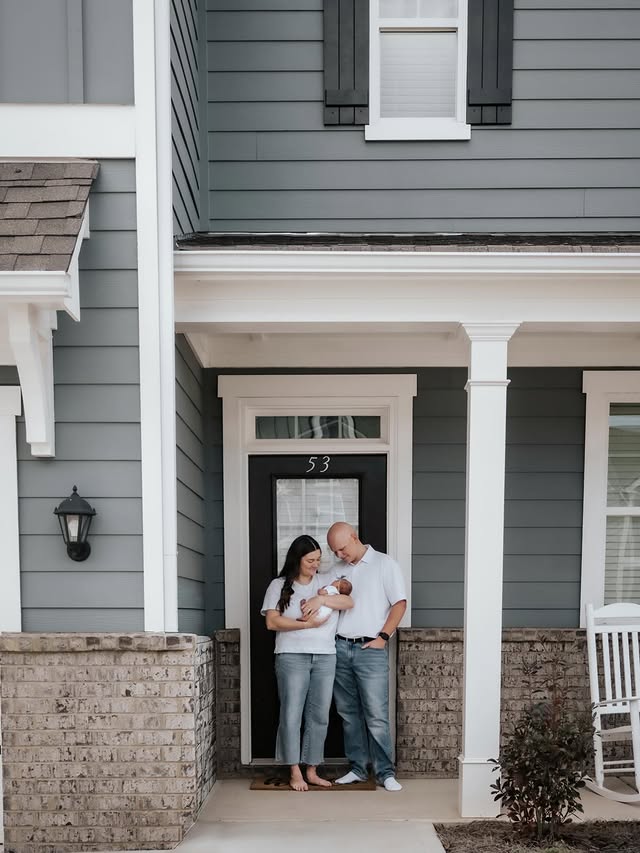 Family on the porch with their newborn